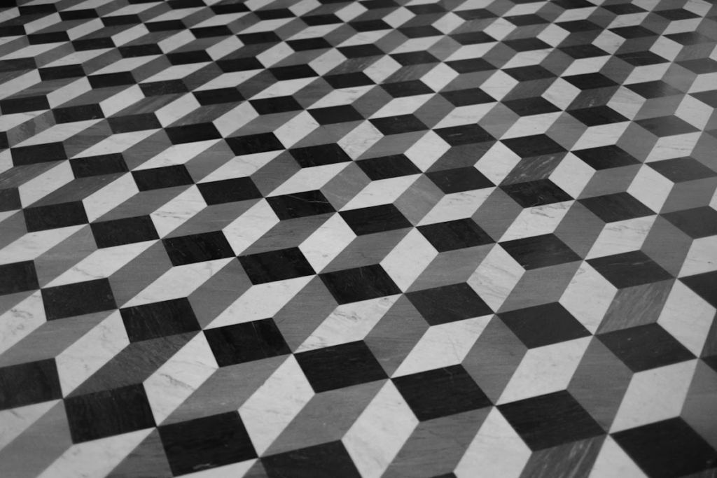Black-and-white tessellated floor forming a 3D cube effect