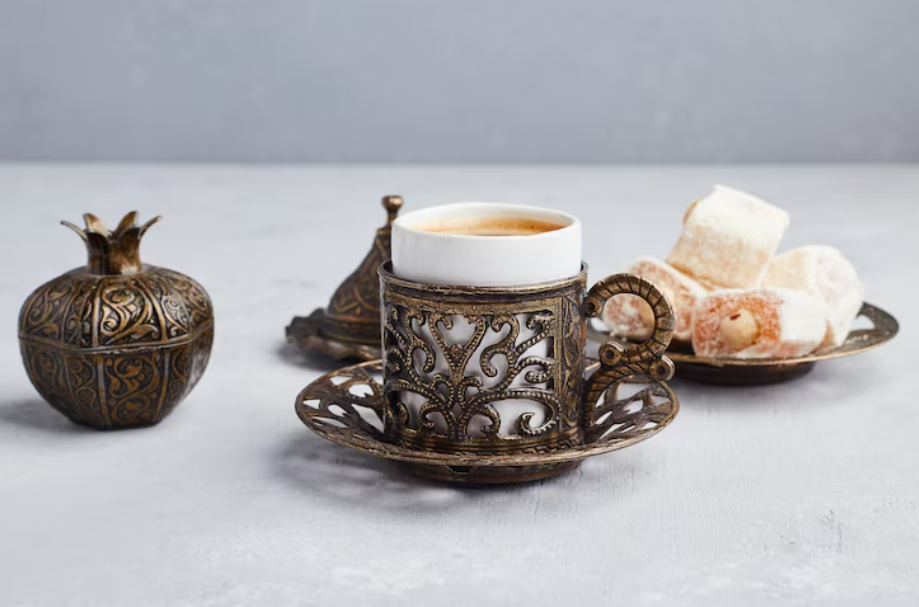 Ornate Ottoman-style coffee cup and saucer, echoing coffee’s royal court origins