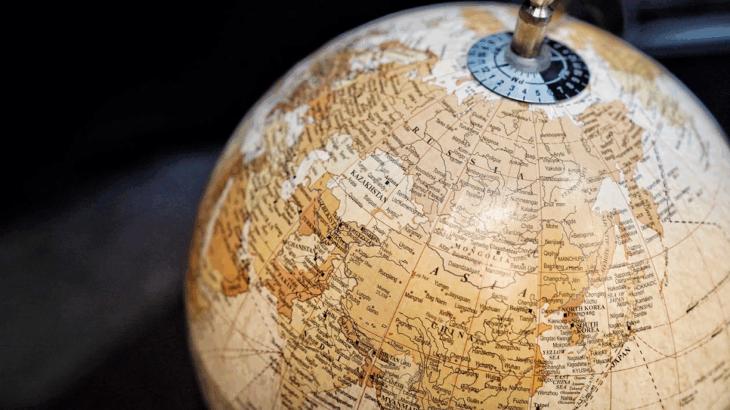 Close-up of a vintage globe evoking shifting borders and countries that no longer exist.